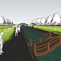 Rural Landscape With Outdoor Seating Area Walking Path People And Cyclist Under Blue Sky