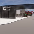 Modern Commercial Street With Red Pedestrian Bridges Green Roofs And Outdoor Seating