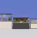 Three Aquarium Fish Tanks With White And Dark Cabinets Fish And Plants