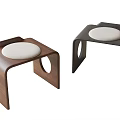 Two Modern Wooden Stools With Circular Cutouts And White Padded Seats
