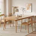 Cozy Indoor Wooden Dining Table Set With Four Chairs Tea Set Vase And White Flowers