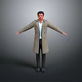 Portrait of man wearing long trench coat and shirt with arms outstretched against gray background