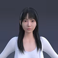A Woman With Long Black Hair And Fringe Wearing White Top Against Gray Background
