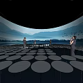 Modern Exhibition Hall with Circular Reflective Floor Design and People Visiting with Mountain Sky Background