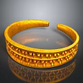 Elegant Golden Metal Bracelet With Intricate Carved Textured Surface Patterns