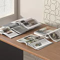 Open Books And Magazines On Wooden Table With Decorative Wall Pattern 3d model