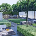 Tranquil Courtyard Garden with Green Lawn Stone Pathway and Outdoor Seating