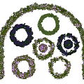 Multiple Circular Flower Wreaths With Purple Flowers And Green Leaves