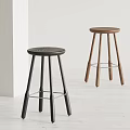 Modern Bar Stools With Black And Wooden Legs Round Seats And Metal Footrests
