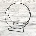 Black Metal Round Storage Shelf with Stable Base on Marble Background