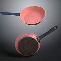 Pink Cooking Pans With Blue And Black Handles For Everyday Kitchen Use