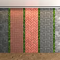Colored Paving Bricks In Herringbone Pattern With Green Plant Borders On Sand