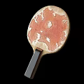 Two Table Tennis Paddles With Orange White Marbled Surface And Dark Handles As Sport Equipment