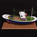 Detailed Decorative Model Ship With White Blue Green And Red Hull On Wooden Base