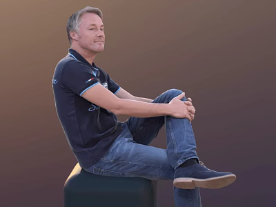A Man Sitting On A Green Cube Wearing Dark Blue Polo Shirt And Blue Jeans 3d model