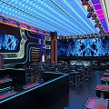 Stylish Bar Interior Design With Colorful Neon Lights Large Screens And Seating Areas