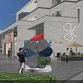 Modern Commercial Street With Multi Story Building Storefronts And Pedestrians Walking