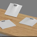 Three Modern White Digital Scales As Business Equipment On Wooden Table