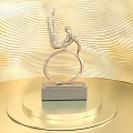 Silver Trophy Featuring Human Figure Wings Ring on Circular Golden Pedestal Against Golden Wavy Background