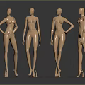 Four Gold Female Mannequins in Different Poses on Round Bases Against Gray Background