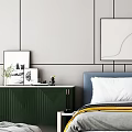 Blue Bed with White Gray Pillows Yellow Blanket Green Cabinet Decorative Paintings and Golden Light