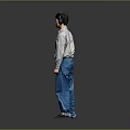 Man in Light Long Sleeve Shirt and Blue Jeans Standing with Headphones Against Gray Background