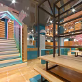 Modern Blue Store Exterior With Glass Doors Windows And Night Lighting