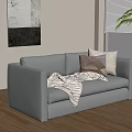 Gray Two Seater Sofa with Pillows and Blanket on Wooden Floor near Window with Plant