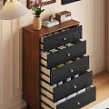 Wooden Chest of Drawers Featuring Dark Blue Drawers Golden Handles And Top Vase Books Clock