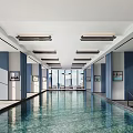 Spacious Indoor Swimming Pool Area With Blue Pillars Ceiling Lights And Floor to Ceiling Windows