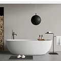 White Freestanding Bathtub with Black Globe Light Wood Column and Bath Products in Modern Bathroom
