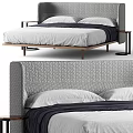 Modern Upholstered Double Bed with Quilted Gray Headboard White Pillows and Wooden Legs