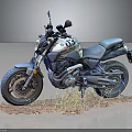 White and Blue Motorcycle with Number 03 Parked on Sandy Ground with Grass