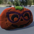 Cute Halloween Pumpkin Shaped Pillow with Purple Glasses and Smiling Face