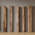 Wooden Planks With Various Textures And Colors Arranged Against Gray Wall On Herringbone Wooden Floor