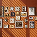 Interior Photo Wall With Various Frames And Different Designed Photos On Brown Wall