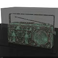 Bronze Radio Shaped Sculpture With Intricate Carving Details In Display Case