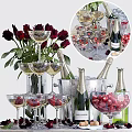 Elegant Wine Bottles and Wine Glasses with Red Roses Cherries and Ice Bucket