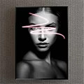 Black and White Portrait of a Woman with Pink Neon Light Streaks on Her Face
