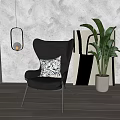 Black Leather Accent Chair with Blue White Patterned Pillow Hanging Lantern Green Plant Abstract Painting