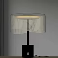 Modern Table Lamp With White Marble Texture Shade And Black Base On Wooden Table