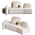 Modern White Sectional Sofa With Curved Design Soft Cushions And Green Decorative Ball