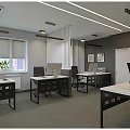 Modern Public Office Space With Open Layout Multiple Desks Computers Office Chairs And Plants