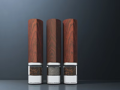 Wooden Lid Spice Grinders With Silver Bases And Spice Granules On Dark Background And Gray Tabletop 3d model