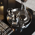 Clear Glass Wine Decanter And Glasses On Silver Tray Over Black Tabletop