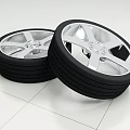 Pair of Car Tires With Silver Alloy Rims And Detailed Tread Pattern Design