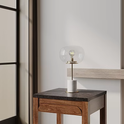 Contemporary Table Lamp with Transparent Glass Globe Shade and White Base on Dark Countertop Wooden Cabinet 3d model