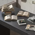 Open Books and Stacked Magazines on Dark Wooden Table with Various Covers