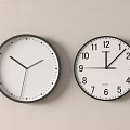 Two Wall Clocks Minimalist Dot Markers Numeric Dial Black Frames White Faces On White Wall 3d model