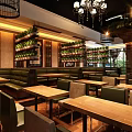 Elegant Restaurant Interior With Chandeliers Green Plants Round Tables And Green Chairs
